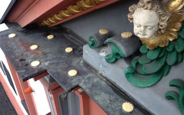 Pigeon proofing installation on the ledge of a historic building